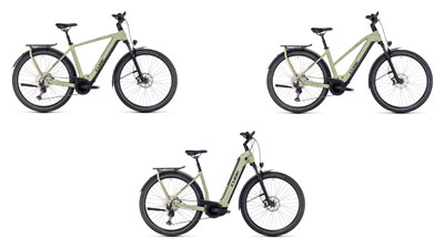 On display are three white Cube Kathmandu hybrid e-bikes, each with a diamond frame, a trapezoidal frame, and a low step-through frame.