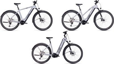 On display are three white Cube Nuride Hybrid e-bikes, each with a diamond frame, a trapezoidal frame, and a low step-through frame.
