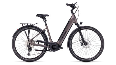 The image shows a brown Cube Supreme Hybrid EXC e-bike with a low step-through frame.