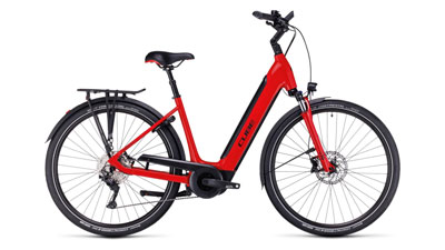 On display is a red Cube Supreme Hybrid EXC e-bike with a low step-through frame.