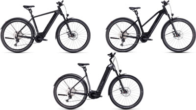 On display are three black Cube Nuride Hybrid e-bikes, each with a diamond frame, a trapezoidal frame, and a low step-through frame.