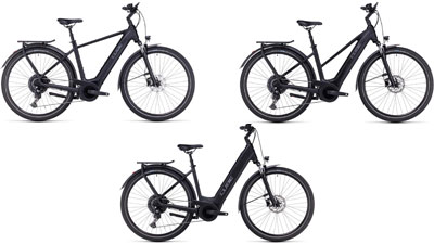 On display are three black Cube Touring Hybrid ONE e-bikes, each with a diamond frame, a trapezoidal frame, and a low step-through frame.