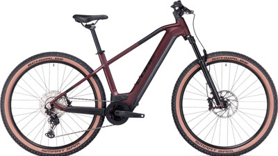 A dark red Cube Reaction Hybrid bike can be seen.
