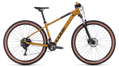 Cube Aim EXC hardtail mountain bike in mustard color.